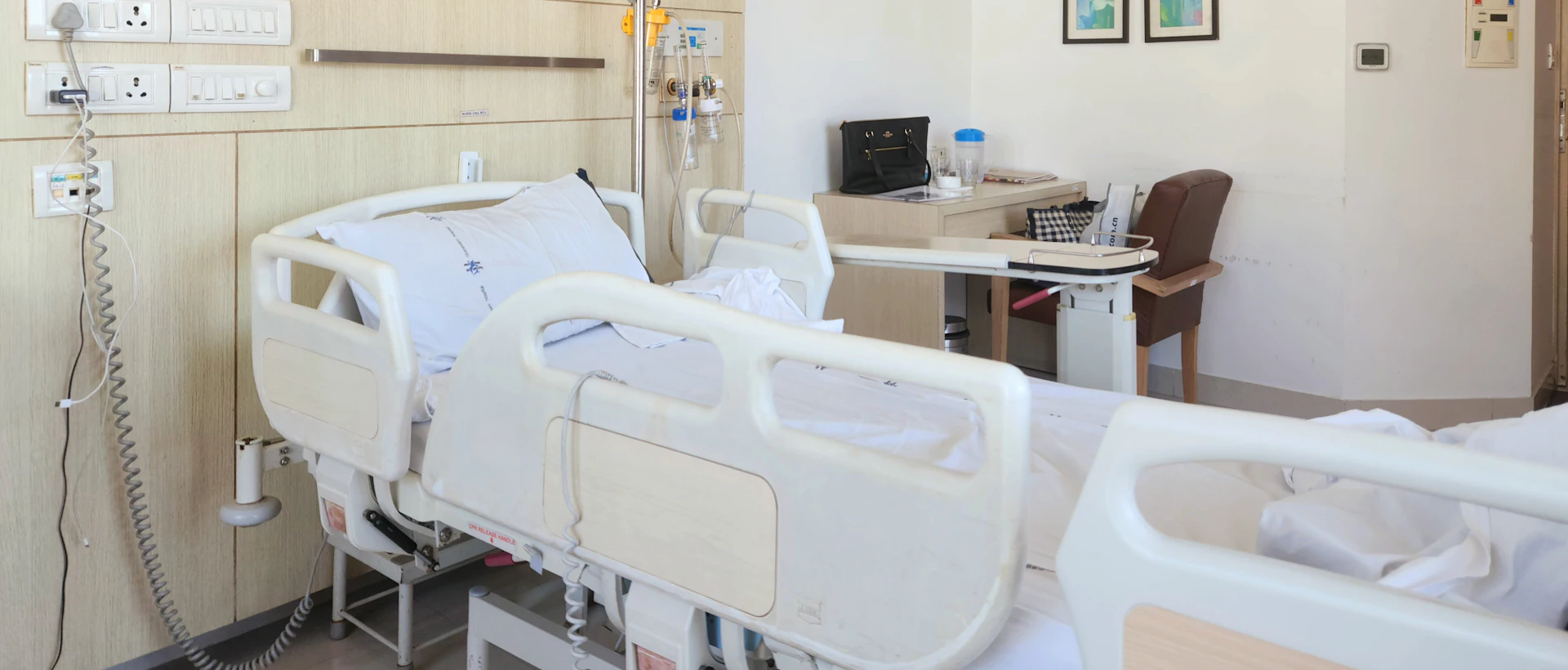 Home-care bed and patient-care equipment in a bright room